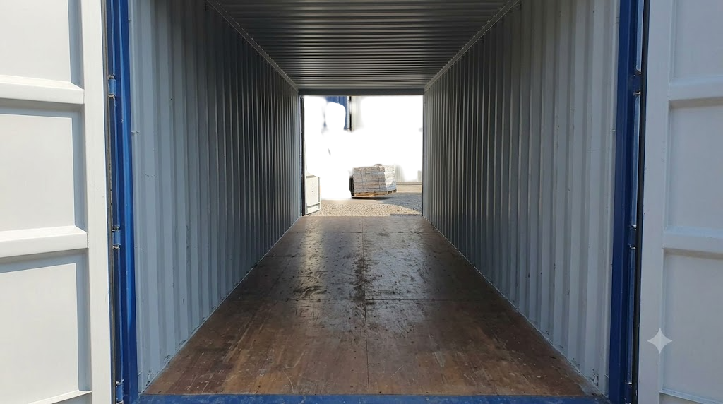 Interior view of a blue tunnel shipping container for sale showing open doors at both ends and a timber floor